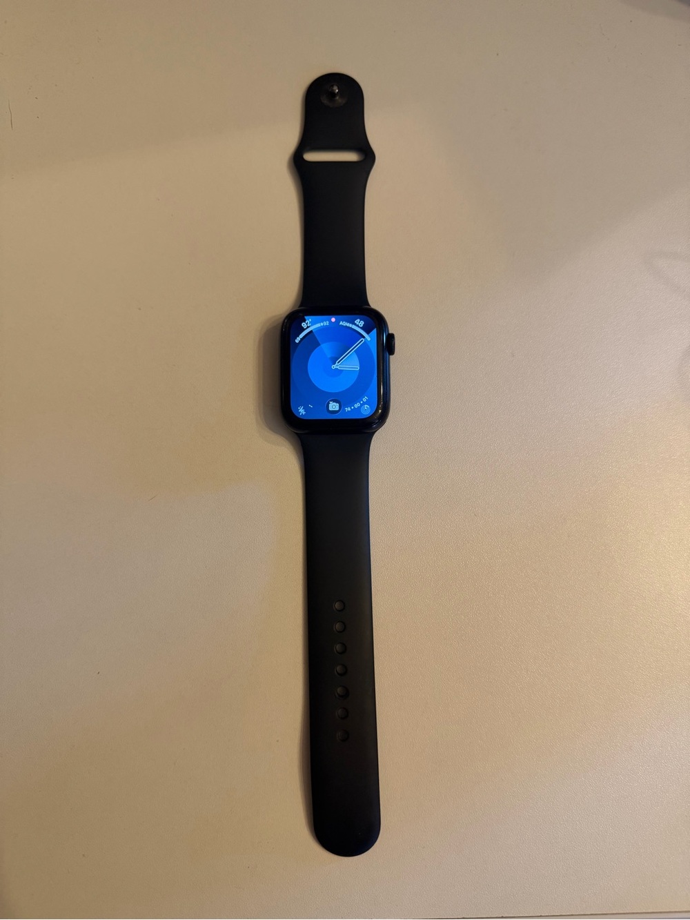 Apple Watch with Black Sport Band and Blue Watchface